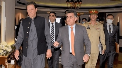 A file photo of ex-Pakistan ISI chief Faiz Hameed with Imran Khan A file photo of ex-Pakistan ISI chief Faiz Hameed with Imran Khan