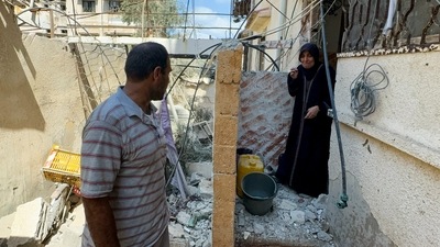 A woman reacts as Palestinians inspect the site of an Israeli strike on a house, amid Israel-Hamas conflict, in Gaza City August 12, 2024. (REUTERS)