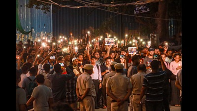 New Delhi: Students take part in a candle light vigil outside the Rau's IAS Study Circle where 3 students drown in the flooded basemnet, in New Delhi, Saturday, Aug. 3, 2024. (PTI Photo) (PTI) New Delhi: Students take part in a candle light vigil outside the Rau's IAS Study Circle where 3 students drown in the flooded basemnet, in New Delhi, Saturday, Aug. 3, 2024. (PTI Photo) (PTI)