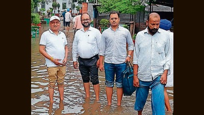 Residents on a waterlogged lane outside Ambala district courts on Monday. (HT Photo) Residents on a waterlogged lane outside Ambala district courts on Monday. (HT Photo)