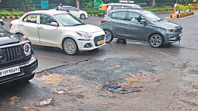 The damaged section of the road at Windsor Place. (HT Photo) The damaged section of the road at Windsor Place. (HT Photo)
