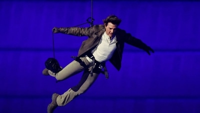 Tom Cruise leaps from the top of the stadium at Paris Olympics