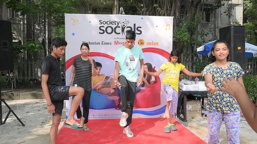 Both the young and the old participated in outdoor activities such as this game of balancing.