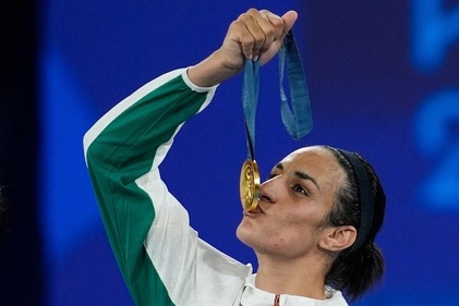 Gold medalist Algeria's Imane Khelif kisses her gold medal for the women's 66 kg final boxing match (AP) Gold medalist Algeria's Imane Khelif kisses her gold medal for the women's 66 kg final boxing match (AP)