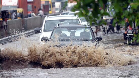 A waterlogged stretch after heavy rain on NH 48 near Narsinghpur in Gurugram on Monday. (Parveen Kumar/HT Photo)