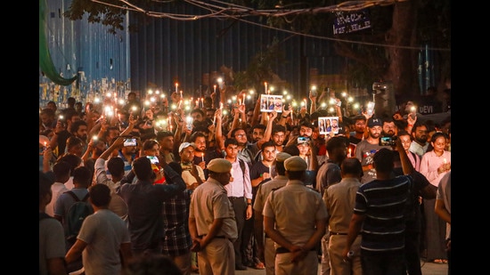 New Delhi: Students take part in a candle light vigil outside the Rau's IAS Study Circle where 3 students drown in the flooded basemnet, in New Delhi, Saturday, Aug. 3, 2024. (PTI Photo) (PTI)