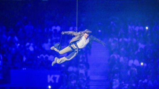 Tom Cruise is lowered on the Stade de France during the 2024 Summer Olympics closing ceremony, Sunday, Aug. 11, 2024, in Saint-Denis, France. (AP Photo/Natacha Pisarenko)(AP)