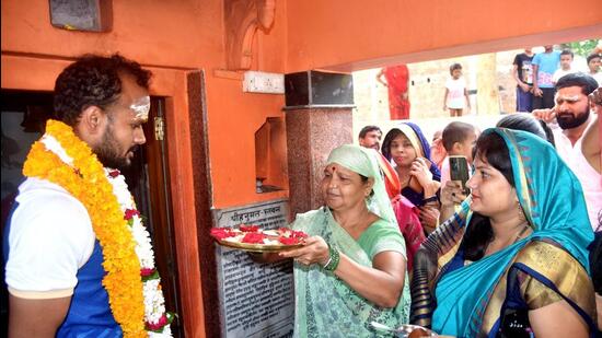 Paris Olympics bronze medallist hockey player Lalit Upadhyay being welcomed by his mother at his residence. (PTI)