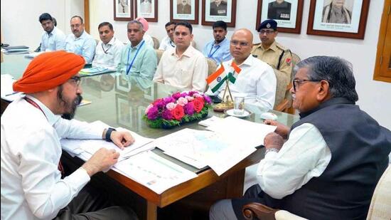 Punjab governor Gulab Chand Kataria chairs a review meeting with senior officials of the National Highway Authority, Railways, Airport Authority and BSNL to review the progress report of various ongoing Central development projects, at Raj Bhavan in Chandigarh on Monday. (Gulab Chand Kataria - X)