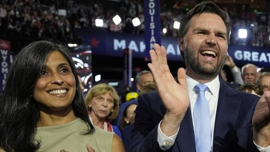 Republican vice-presidential candidate Senator JD Vance, R-Ohio, and his wife Usha Chilukuri Vance arrive on the floor during the first day of the 2024 Republican National Convention at the Fiserv Forum, on Monday. (AP)