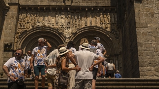 Rethinking travel: How to avoid being a 'bad tourist' this summer (Photographer: Brais Lorenzo/Bloomberg)