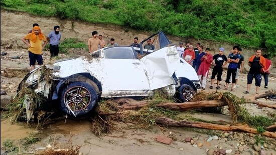 The Innova that got swept away in flooded rivulet in Hoshiarpur’s Jaijon killing at least nine occupants. (HT File)