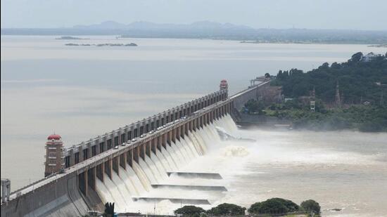 The chain of a crust gate of theTungabhadra dam broke, leading to the release of huge amount of water, on Sunday. (PTI)