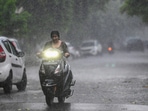 Commuters step out during evening rain at sector 12, in Noida, India, on Sunday, August 04, 2024. (Photo by Sunil Ghosh / Hindustan Times) Commuters step out during evening rain at sector 12, in Noida, India, on Sunday, August 04, 2024. (Photo by Sunil Ghosh / Hindustan Times)