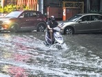 A commuter wades through a waterlogged road after rain, at New Friends Colony in New Delhi. (RAJ K RAJ /HT PHOTO) A commuter wades through a waterlogged road after rain, at New Friends Colony in New Delhi. (RAJ K RAJ /HT PHOTO)