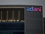 The logo of the Adani Group is seen on the facade of one of its buildings on the outskirts of Ahmedabad.