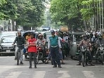 A student volunteer (L) and police personnel controls traffic after the Bangladeshi police force resumed duty, in Dhaka. (AFP) A student volunteer (L) and police personnel controls traffic after the Bangladeshi police force resumed duty, in Dhaka. (AFP)