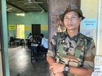 A security personnel stands guard outside a polling booth for three-tier Panchayat elections at Ballabpur under Suryamaninagar, in West Tripura district. (PTI) A security personnel stands guard outside a polling booth for three-tier Panchayat elections at Ballabpur under Suryamaninagar, in West Tripura district. (PTI)