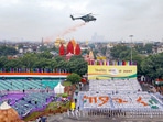 Helicopter showers flower petals on participants of the Dress Rehearsal for Independence Day(Photo: PTI) Helicopter showers flower petals on participants of the Dress Rehearsal for Independence Day(Photo: PTI)