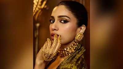 She finished her look with a sleek bun, adding a touch of elegance to her ensemble. The neat hairstyle perfectly complemented her glamorous outfit. (Instagram/@bhumipednekar) She finished her look with a sleek bun, adding a touch of elegance to her ensemble. The neat hairstyle perfectly complemented her glamorous outfit. (Instagram/@bhumipednekar)