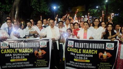 Doctors from the Indian Medical Association stage a candle march in Gurugram on Tuesday. (ANI) Doctors from the Indian Medical Association stage a candle march in Gurugram on Tuesday. (ANI)