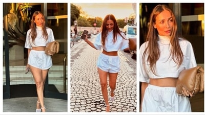 Malaika Arora donned a casual white co-ord set on her vacation. Radiating with sun-kissed vibes, her monochrome ensemble consisted of a matching white loose crop trop, shorts and dainty heels. She accesorised with a beige bag.&nbsp; (Instagram/@malaikaaroraofficial)