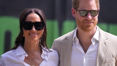 Prince Harry, right, and Meghan, left, attend the Giant of Africa Foundation at the Dream Big Basketball clinic in Lagos Nigeria, Sunday, May 12, 2024. (AP) Prince Harry, right, and Meghan, left, attend the Giant of Africa Foundation at the Dream Big Basketball clinic in Lagos Nigeria, Sunday, May 12, 2024. (AP)