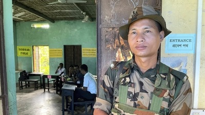 A security personnel stands guard outside a polling booth for three-tier Panchayat elections at Ballabpur under Suryamaninagar, in West Tripura district. (PTI) A security personnel stands guard outside a polling booth for three-tier Panchayat elections at Ballabpur under Suryamaninagar, in West Tripura district. (PTI)