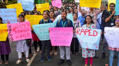 Resident doctors protest against the sexual assault and killing of a postgraduate trainee doctor in Kolkata. (PTI) Resident doctors protest against the sexual assault and killing of a postgraduate trainee doctor in Kolkata. (PTI)