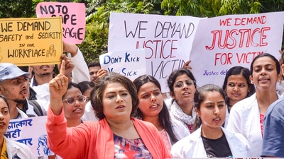 Ranchi: Junior doctors of Rajendra Institute of Medical Sciences (RIMS) stage a protest against the sexual assault and murder of a postgraduate trainee doctor in Kolkata, in Ranchi, Tuesday, Aug. 13, 2024. (PTI Photo)(PTI08_13_2024_000017A) (PTI) Ranchi: Junior doctors of Rajendra Institute of Medical Sciences (RIMS) stage a protest against the sexual assault and murder of a postgraduate trainee doctor in Kolkata, in Ranchi, Tuesday, Aug. 13, 2024. (PTI Photo)(PTI08_13_2024_000017A) (PTI)