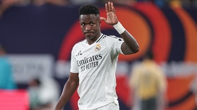 Real Madrid forward Vinicius Junior (7) gestures to fans during the second half of an international friendly against Barcelona (Reuters)