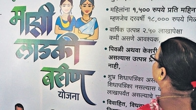 Thane, India - August 06, 2024: The board of Chief Minister Majhi Ladki Bahin Yojana ( scheme ) has been put up in Thane Municipal Corporation for the information of women A woman is seen reading the rules of this scheme , in Thane,in Mumbai, India, on, Tuesday, August 06, 2024. ( Praful Gangurde /HT Photo ) Thane, India - August 06, 2024: The board of Chief Minister Majhi Ladki Bahin Yojana ( scheme ) has been put up in Thane Municipal Corporation for the information of women A woman is seen reading the rules of this scheme , in Thane,in Mumbai, India, on, Tuesday, August 06, 2024. ( Praful Gangurde /HT Photo )