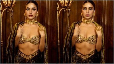 In terms of accessories, she opted for gold jewellery, enhancing her look with a multi-layered choker necklace, dangling statement earrings, and a stunning golden handpiece that added an extra touch of elegance. (Instagram/@bhumipednekar) In terms of accessories, she opted for gold jewellery, enhancing her look with a multi-layered choker necklace, dangling statement earrings, and a stunning golden handpiece that added an extra touch of elegance. (Instagram/@bhumipednekar)