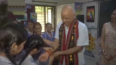 Students tie Rakhi to Manish Sisodia ahead of Raksha Bandhan (ANI) Students tie Rakhi to Manish Sisodia ahead of Raksha Bandhan (ANI)