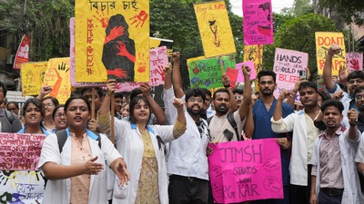 Junior doctors, trainee doctors and medical students protest against the sexual assault and killing of a post-graduate trainee doctor at RG Kar Medical College, in Kolkata, (PTI)