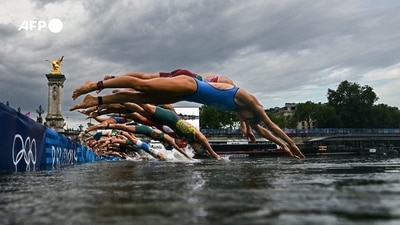 With several training sessions cancelled due to poor water quality, it was uncertain until the last moment whether events would take place in the River Seine, despite months of preparations. Finally, the women's triathlon became the first to use the river on July 31. The first Olympic dive was captured from the water by Martin Bureau, equipped with a waterproof case for his camera, at the foot of the Alexandre III bridge. With several training sessions cancelled due to poor water quality, it was uncertain until the last moment whether events would take place in the River Seine, despite months of preparations. Finally, the women's triathlon became the first to use the river on July 31. The first Olympic dive was captured from the water by Martin Bureau, equipped with a waterproof case for his camera, at the foot of the Alexandre III bridge.