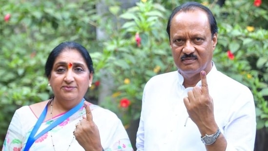 Ajit Pawar with his wife and NCP Baramati candidate Sunetra Pawar.(HT_PRINT)