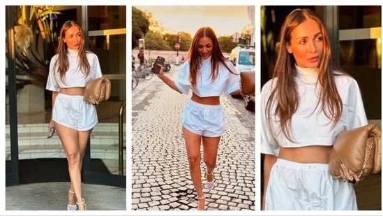 Malaika Arora donned a casual white co-ord set on her vacation. Radiating with sun-kissed vibes, her monochrome ensemble consisted of a matching white loose crop trop, shorts and dainty heels. She accesorised with a beige bag. (Instagram/@malaikaaroraofficial)