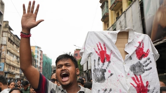 Junior doctors, trainee doctors and medical students during a protest against the sexual assault and killing of a post-graduate trainee doctor at RG Kar Medical College, in Kolkata. (PTI)