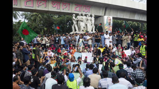 Students shout slogans during a protest demanding trial of former prime minister Sheikh Hasina, in Dhaka, Bangladesh, Tuesday, Aug. 13, 2024. (AP Photo/Rajib Dhar) (AP)