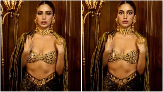 In terms of accessories, she opted for gold jewellery, enhancing her look with a multi-layered choker necklace, dangling statement earrings, and a stunning golden handpiece that added an extra touch of elegance.(Instagram/@bhumipednekar)