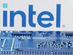 Intel logo is seen near computer motherboard.