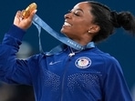 Simone Biles, of the United States, celebrates after winning the gold medal during the women's artistic gymnastics all-around finals in Bercy Arena(AP) Simone Biles, of the United States, celebrates after winning the gold medal during the women's artistic gymnastics all-around finals in Bercy Arena(AP)