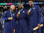 Stephen Curry, LeBron James and Kevin Durant of Team United States pose with the Olympic gold medal.(Getty) Stephen Curry, LeBron James and Kevin Durant of Team United States pose with the Olympic gold medal.(Getty)