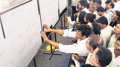 Mumbai, India - 24 Feb. 2016 : People checking out there name in the list of MHADA lottery results were to be announced at Rang Sharda Hotel,Bandra in Mumbai, India, on Wednesday, February 24, 2016. (Photo by Pramod Thakur/ Hindustan Times) (Hindustan Times) Mumbai, India - 24 Feb. 2016 : People checking out there name in the list of MHADA lottery results were to be announced at Rang Sharda Hotel,Bandra in Mumbai, India, on Wednesday, February 24, 2016. (Photo by Pramod Thakur/ Hindustan Times) (Hindustan Times)