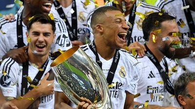 Kylian Mbappe celebrates his first trophy with Real Madrid teammates (REUTERS)
