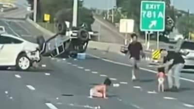 Two toddlers in diapers on landed on the highway after the collision of two cars. (@CollinRugg/X) Two toddlers in diapers on landed on the highway after the collision of two cars. (@CollinRugg/X)