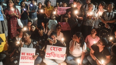 Residents hold a peaceful candle light demonstration against the rape and murder of a trainee doctor at Kolkata's R.G. Kar Hospital, in Mumbai, Wednesday, Aug 14, 2024. (PTI) Residents hold a peaceful candle light demonstration against the rape and murder of a trainee doctor at Kolkata's R.G. Kar Hospital, in Mumbai, Wednesday, Aug 14, 2024. (PTI)