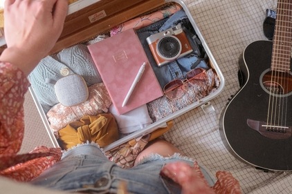 Pack light with reusable items and multi-purpose toiletries to minimise waste and reduce your travel footprint. (Unsplash)