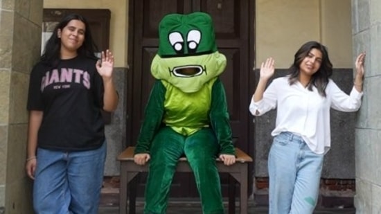 Malhar's mascot Puddles poses with college kids(instagram)